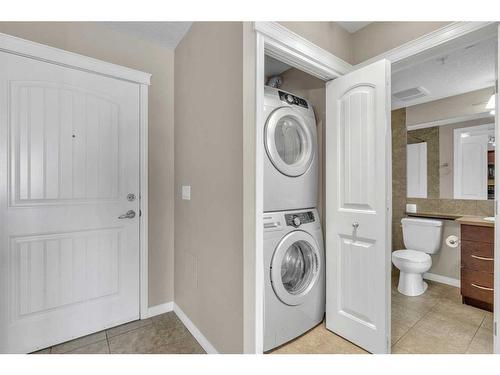 1310-175 Panatella Hill Nw, Calgary, AB - Indoor Photo Showing Laundry Room