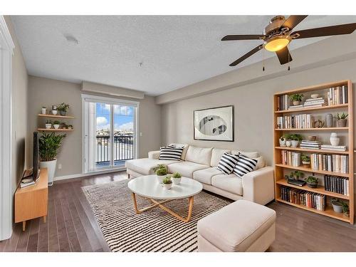 1310-175 Panatella Hill Nw, Calgary, AB - Indoor Photo Showing Living Room