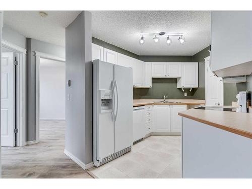 307-3 Somervale View Sw, Calgary, AB - Indoor Photo Showing Kitchen With Double Sink