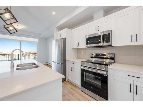 210-30 Sage Hill Walk Nw, Calgary, AB - Indoor Photo Showing Kitchen With Double Sink