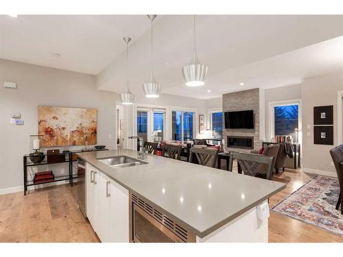 4-2432 30 Street Sw, Calgary, AB - Indoor Photo Showing Kitchen With Fireplace With Double Sink