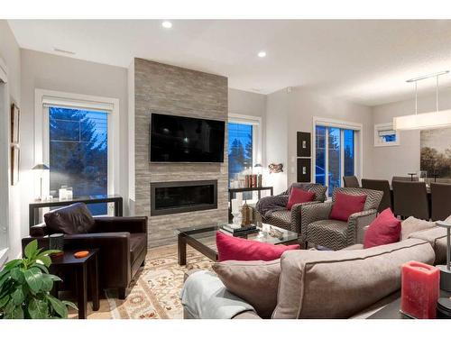 4-2432 30 Street Sw, Calgary, AB - Indoor Photo Showing Living Room With Fireplace