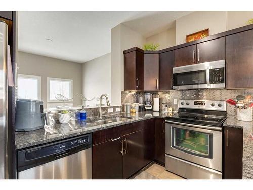 105 Evanston Square Nw, Calgary, AB - Indoor Photo Showing Kitchen With Stainless Steel Kitchen With Double Sink With Upgraded Kitchen