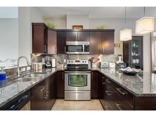 105 Evanston Square Nw, Calgary, AB - Indoor Photo Showing Kitchen With Stainless Steel Kitchen With Double Sink With Upgraded Kitchen