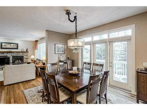 70 Valley Crest Rise Nw, Calgary, AB - Indoor Photo Showing Dining Room With Fireplace