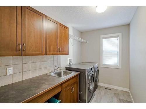 70 Valley Crest Rise Nw, Calgary, AB - Indoor Photo Showing Laundry Room