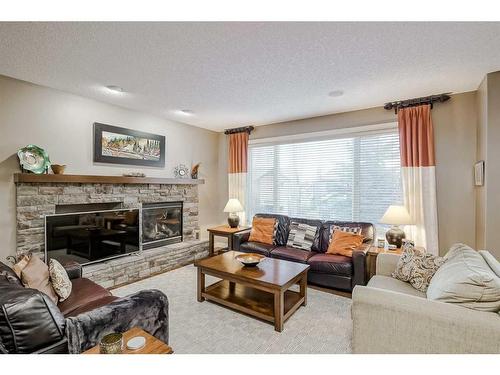 70 Valley Crest Rise Nw, Calgary, AB - Indoor Photo Showing Living Room With Fireplace