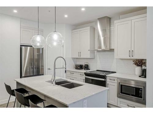 318-40 Walgrove Walk Se, Calgary, AB - Indoor Photo Showing Kitchen With Stainless Steel Kitchen With Double Sink With Upgraded Kitchen