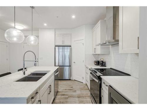 318-40 Walgrove Walk Se, Calgary, AB - Indoor Photo Showing Kitchen With Stainless Steel Kitchen With Double Sink With Upgraded Kitchen