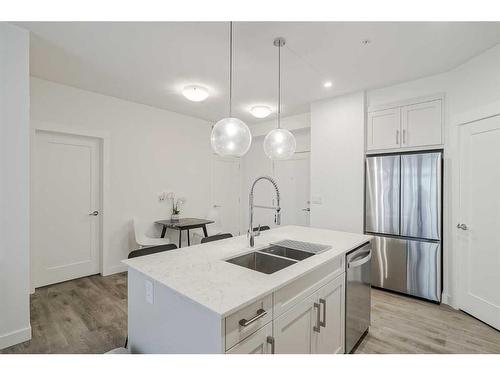 318-40 Walgrove Walk Se, Calgary, AB - Indoor Photo Showing Kitchen With Stainless Steel Kitchen With Double Sink With Upgraded Kitchen