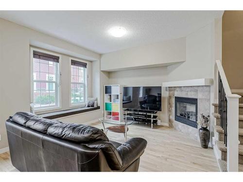 1212-155 Silverado Skies Link Sw, Calgary, AB - Indoor Photo Showing Living Room With Fireplace