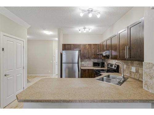 1212-155 Silverado Skies Link Sw, Calgary, AB - Indoor Photo Showing Kitchen With Double Sink