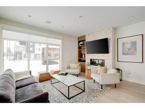 2557 21 Avenue Sw, Calgary, AB - Indoor Photo Showing Living Room With Fireplace