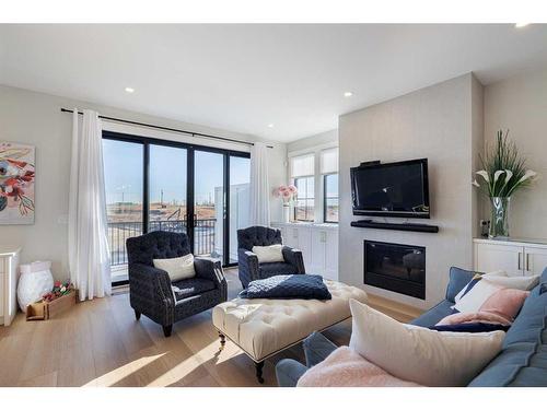 54-130 Discovery Drive Sw, Calgary, AB - Indoor Photo Showing Living Room With Fireplace