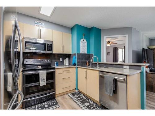 2120-60 Panatella Street Nw, Calgary, AB - Indoor Photo Showing Kitchen With Double Sink