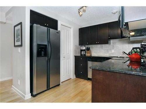 305-728 3 Avenue Nw, Calgary, AB - Indoor Photo Showing Kitchen With Upgraded Kitchen