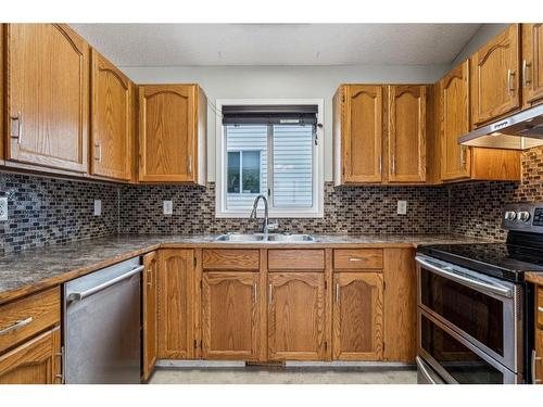 283 Coventry Close Ne, Calgary, AB - Indoor Photo Showing Kitchen With Double Sink