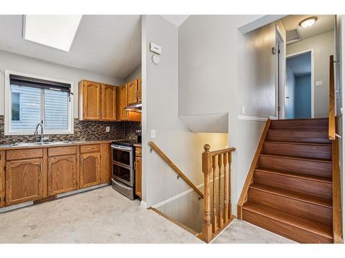 283 Coventry Close Ne, Calgary, AB - Indoor Photo Showing Kitchen With Double Sink