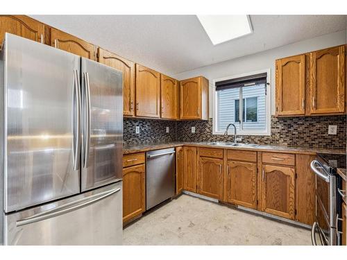 283 Coventry Close Ne, Calgary, AB - Indoor Photo Showing Kitchen With Double Sink