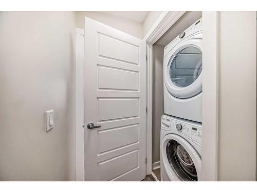 408-19500 37 Street Se, Calgary, AB - Indoor Photo Showing Laundry Room