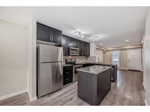 408-19500 37 Street Se, Calgary, AB - Indoor Photo Showing Kitchen With Upgraded Kitchen