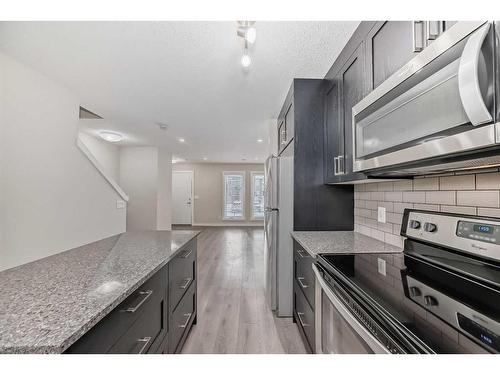 408-19500 37 Street Se, Calgary, AB - Indoor Photo Showing Kitchen With Upgraded Kitchen