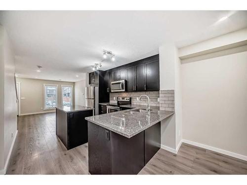 408-19500 37 Street Se, Calgary, AB - Indoor Photo Showing Kitchen With Upgraded Kitchen