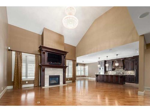 211 Aspen Ridge Place Sw, Calgary, AB - Indoor Photo Showing Living Room With Fireplace