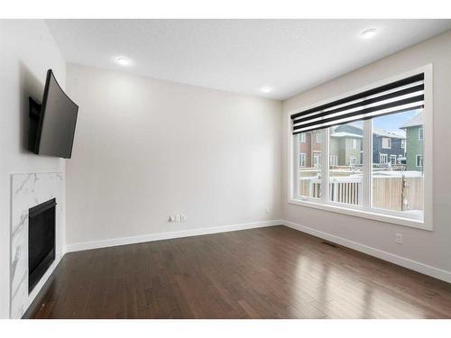 59 Saddlelake Manor Ne, Calgary, AB - Indoor Photo Showing Other Room With Fireplace