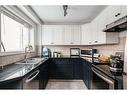 19-4915 8 Street Sw, Calgary, AB  - Indoor Photo Showing Kitchen With Double Sink 