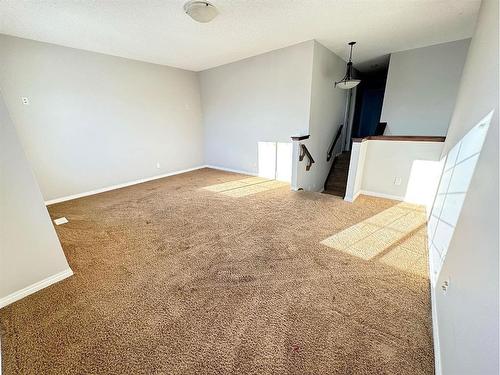 23 Chapman Green Se, Calgary, AB - Indoor Photo Showing Other Room