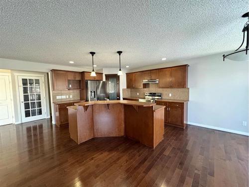 23 Chapman Green Se, Calgary, AB - Indoor Photo Showing Kitchen With Stainless Steel Kitchen