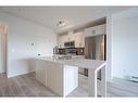 5104-200 Seton Circle Se, Calgary, AB  - Indoor Photo Showing Kitchen With Stainless Steel Kitchen With Double Sink 