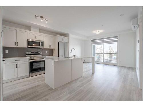 5104-200 Seton Circle Se, Calgary, AB - Indoor Photo Showing Kitchen With Stainless Steel Kitchen With Upgraded Kitchen