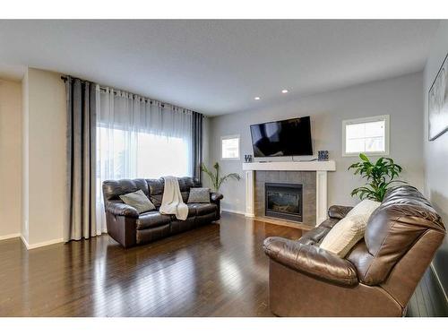 125 Copperstone Close Se, Calgary, AB - Indoor Photo Showing Living Room With Fireplace