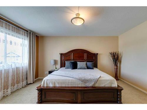 125 Copperstone Close Se, Calgary, AB - Indoor Photo Showing Bedroom