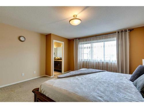 125 Copperstone Close Se, Calgary, AB - Indoor Photo Showing Bedroom