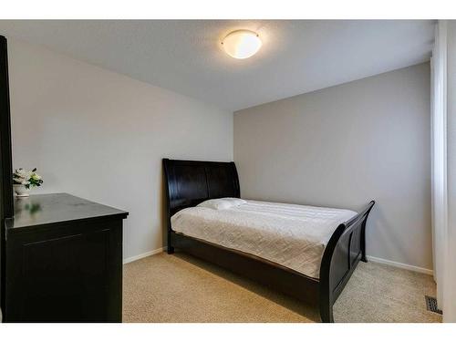 125 Copperstone Close Se, Calgary, AB - Indoor Photo Showing Bedroom