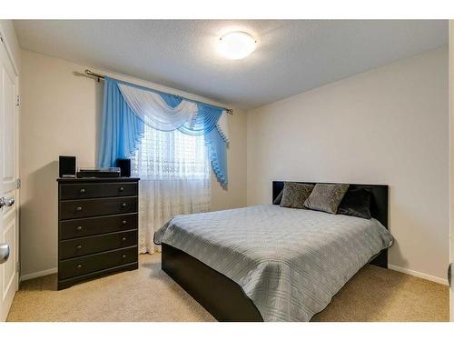 125 Copperstone Close Se, Calgary, AB - Indoor Photo Showing Bedroom