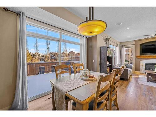 217 Auburn Glen Circle Se, Calgary, AB - Indoor Photo Showing Dining Room With Fireplace