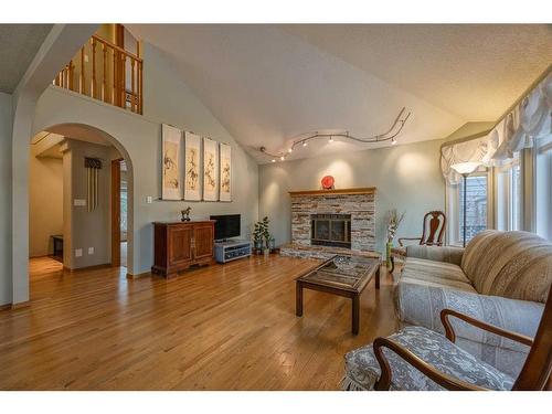 40 Edgepark Way Nw, Calgary, AB - Indoor Photo Showing Living Room With Fireplace