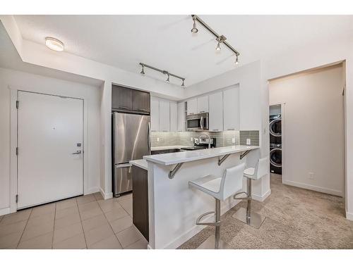 1201-175 Silverado Boulevard Sw, Calgary, AB - Indoor Photo Showing Kitchen With Stainless Steel Kitchen With Upgraded Kitchen