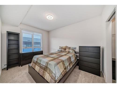 1201-175 Silverado Boulevard Sw, Calgary, AB - Indoor Photo Showing Bedroom