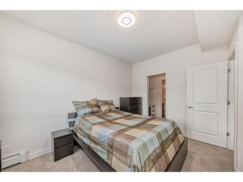 1201-175 Silverado Boulevard Sw, Calgary, AB - Indoor Photo Showing Bedroom