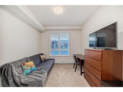 1201-175 Silverado Boulevard Sw, Calgary, AB - Indoor Photo Showing Living Room