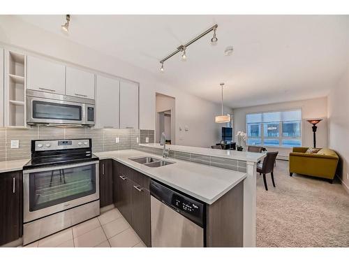 1201-175 Silverado Boulevard Sw, Calgary, AB - Indoor Photo Showing Kitchen With Stainless Steel Kitchen With Double Sink