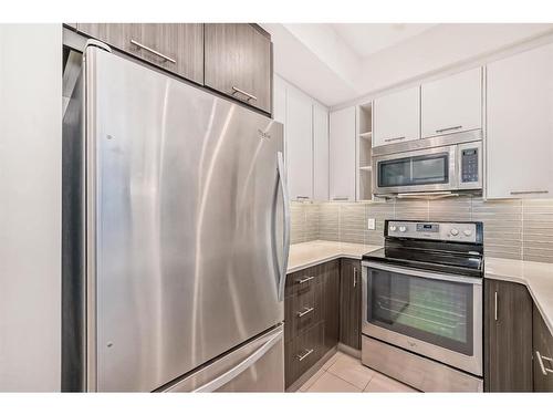 1201-175 Silverado Boulevard Sw, Calgary, AB - Indoor Photo Showing Kitchen With Stainless Steel Kitchen With Upgraded Kitchen