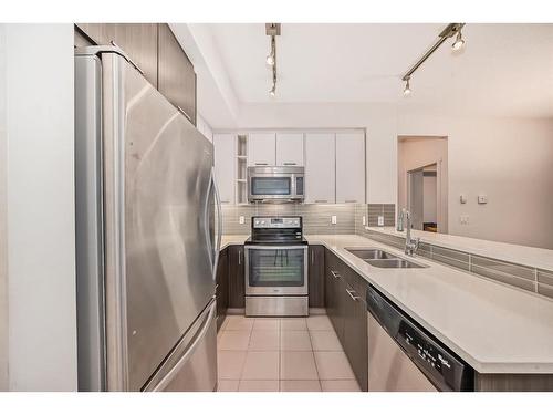 1201-175 Silverado Boulevard Sw, Calgary, AB - Indoor Photo Showing Kitchen With Stainless Steel Kitchen With Double Sink