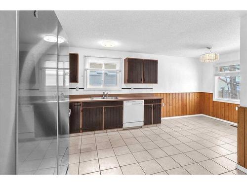 207 Fallswater Road Ne, Calgary, AB - Indoor Photo Showing Kitchen With Double Sink