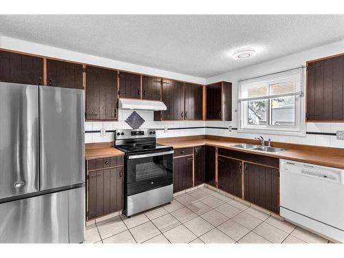 207 Fallswater Road Ne, Calgary, AB - Indoor Photo Showing Kitchen With Double Sink